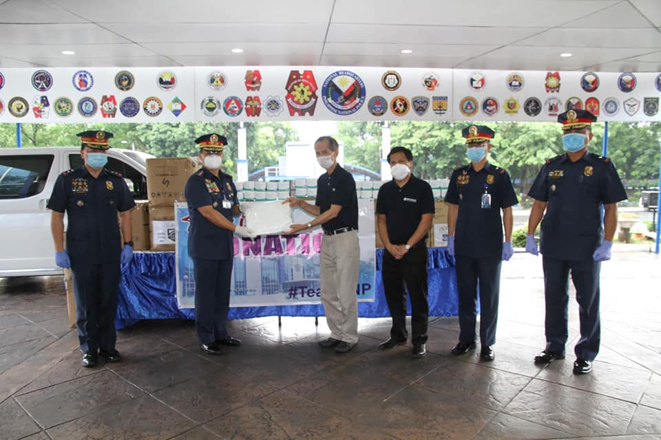Metrobank Foundation executive director Nicanor Torres Jr. and assistant program manager Hero Hernandez present the 54,600 pairs of gloves and 5,000 N95 masks donation to Philippine National Police (PNP), through PNP Chief Gen. Archie Gamboa. The formal turnover ceremony was held on May 5 at Camp Rafael Crame in Quezon City. (Photo by PNP Public Information Office)